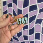 1989 blue glitter enamel keychain